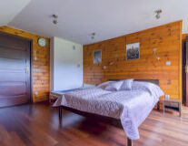a bedroom with a wooden floor